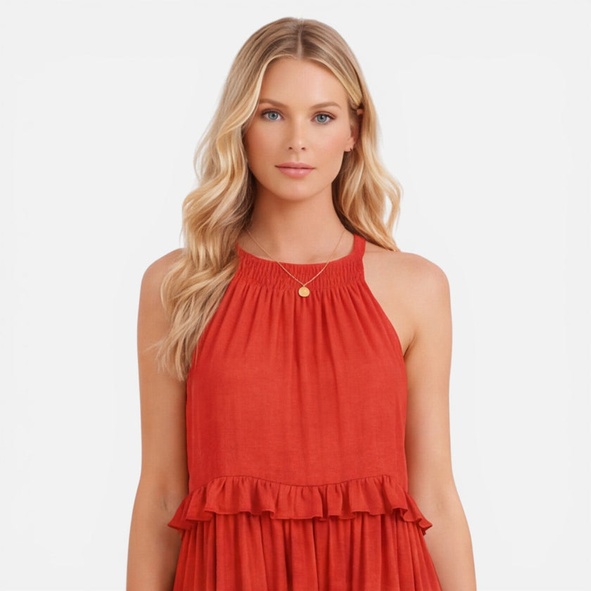 Lightweight women's tiered maxi dress by FJØRNA featuring a flowy design and halter neckline, perfect for summer wear.