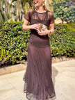 FJØRNA women's elegant mesh pleated wide-leg maxi dress hugging the hips, featuring a flowing design and sophisticated style.