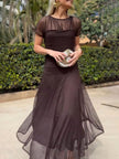 Elegant mesh pleated wide-leg maxi dress for women by FJØRNA, featuring a hip-hugging fit and flowing design.