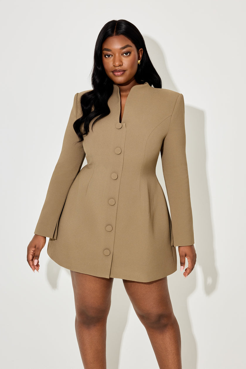 Women's khaki button-down mini dress by FJØRNA with long sleeves, casual elegant style, shown on a model.