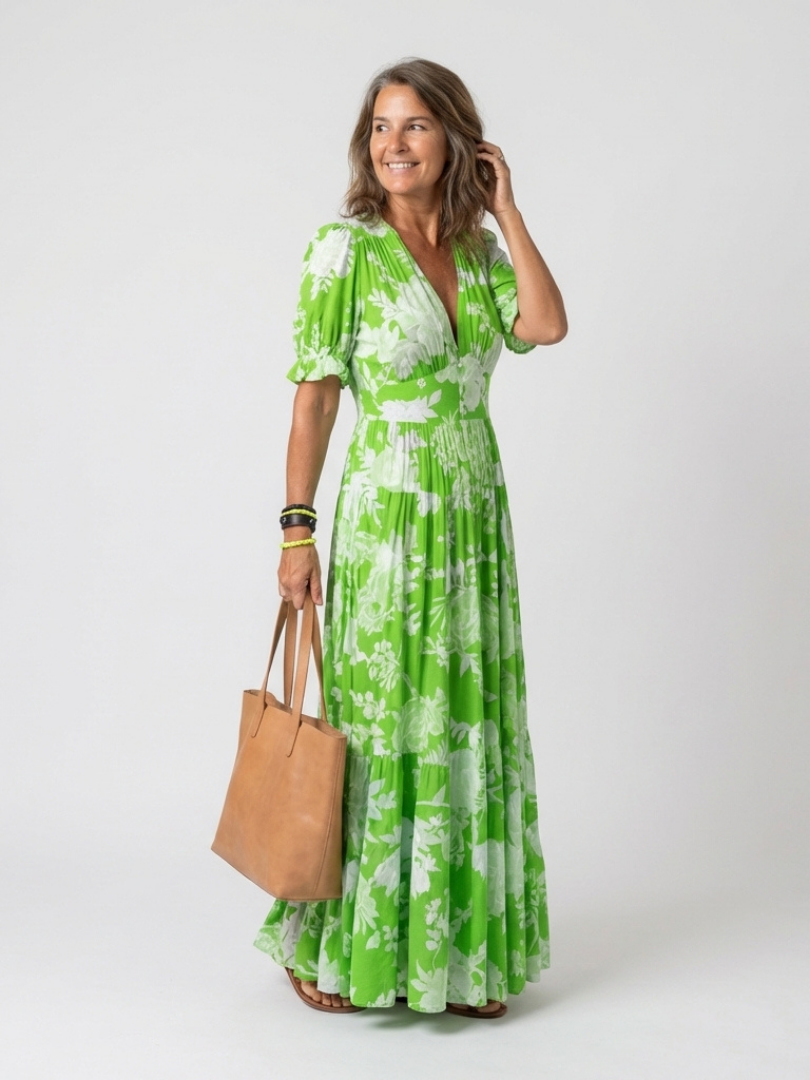 FJØRNA summer midi dress for women with floral pattern and short sleeves, ideal for warm-weather casual wear.