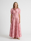 Floral short sleeve summer maxi dress for women by FJØRNA, featuring a flowing design and vibrant floral pattern.