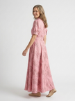 Floral short sleeve summer maxi dress for women by FJØRNA, featuring a breezy, vibrant floral pattern and lightweight fabric.