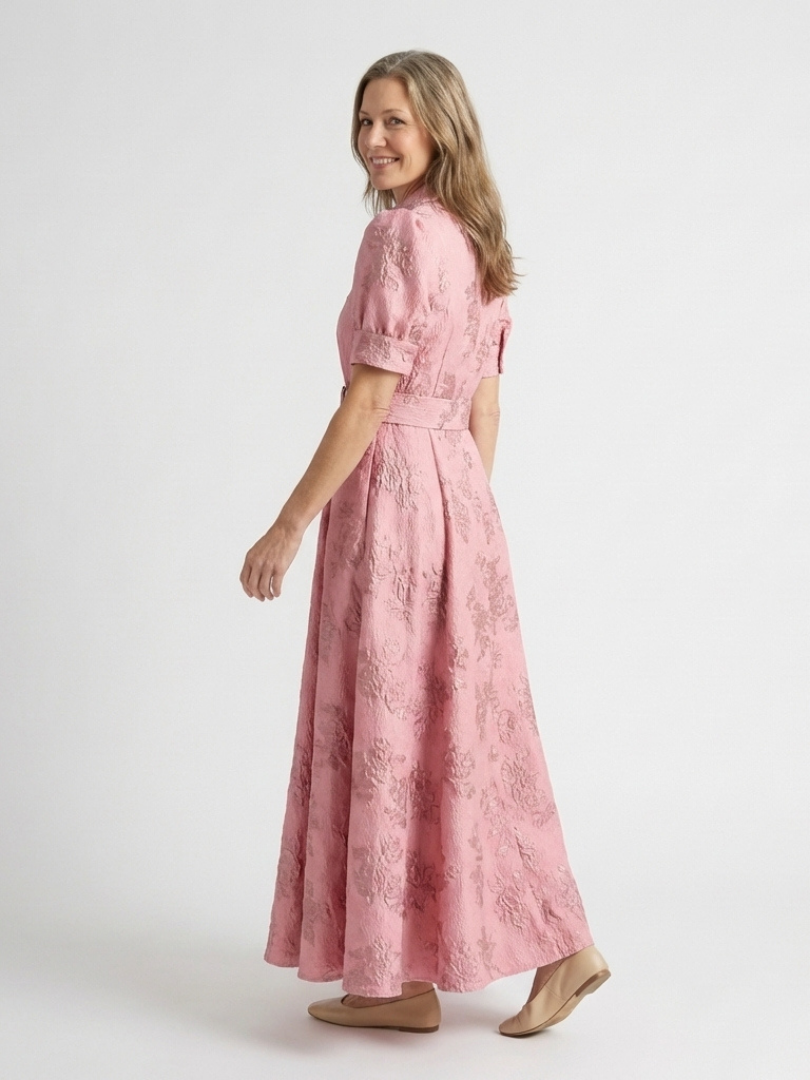 Floral short sleeve summer maxi dress for women by FJØRNA, featuring a breezy, vibrant floral pattern and lightweight fabric.