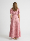 Floral short sleeve summer maxi dress for women by FJØRNA, featuring a flowy design and vibrant floral pattern.