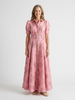 Floral short sleeve summer maxi dress for women by FJØRNA, featuring a flowing design and vibrant floral pattern.
