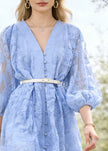 Blue embroidered cotton mini dress with sash and lantern sleeves by FJØRNA, featuring elegant design and stylish details.
