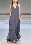 Elegant grey FJØRNA sleeveless chiffon long dress with extra large hem draping, perfect for formal occasions.