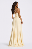 Elegant pale yellow FJØRNA maxi dress with corset-back design, soft drape fabric, and spaghetti straps for women.