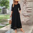 FJØRNA Elegant Maxi Dress in white, featuring flowing fabric and a stylish design, perfect for formal or casual occasions.