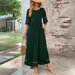 White Trixie Elegant Maxi Dress by FJØRNA, flowing fabric, fitted bodice, and full-length design perfect for special occasions.