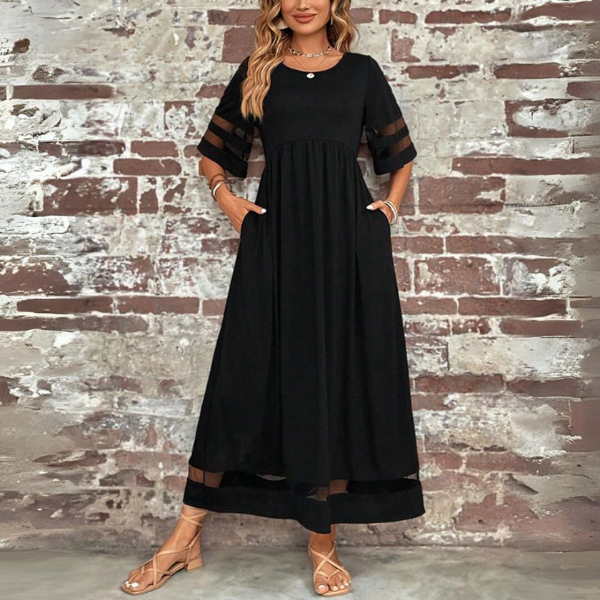 White FJØRNA Trixie Elegant Maxi Dress, flowing fabric, sleeveless design, and stylish silhouette for sophisticated occasions.