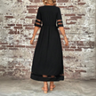 FJØRNA Elegant Maxi Dress in white, flowing fabric, sleeveless design, perfect for summer or formal occasions.