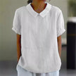 Light-colored summer blouse for women with puff sleeves, made of linen by FJØRNA, shown on a model.