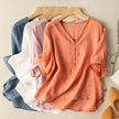 Light beige linen summer blouse for women with V-neck, casual style from FJØRNA, featuring a relaxed fit and breathable fabric.