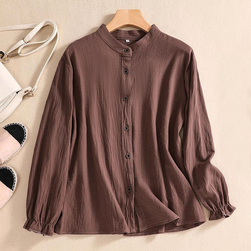 Linen summer blouse for women by FJØRNA featuring a button-front casual design, shown on a model in a relaxed fit.