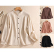 FJØRNA women's linen summer blouse with button front, casual style, light fabric, worn by a model in a relaxed setting.