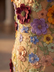 Close-up of FJØRNA elegant floral strapless midi dress for women, showcasing the fabric and intricate floral pattern.