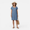 Women's lightweight FJØRNA dress with relaxed fit, breathable fabric, solid color, and practical pockets for casual wear.
