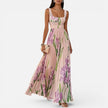 Women's floral elegant maxi dress by FJØRNA featuring a flowy design and side pockets, perfect for stylish occasions.