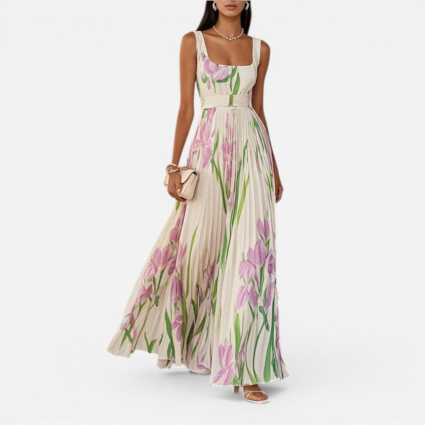 Women's floral elegant maxi dress by FJØRNA featuring a vibrant flower pattern and solid pockets, perfect for stylish occasions.