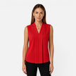 Elegant women's sleeveless blouse by FJØRNA featuring a draped V-neck and timeless fit, ideal for stylish summer outfits.