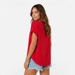 Lightweight women's V-neck T-shirt by FJØRNA with buttons, relaxed fit, perfect for summer, shown in a natural, casual style.