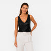 Women's FJØRNA sequin V-neck top for party and evening wear, featuring shiny sequins and a stylish V-neck design.