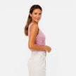Women's FJØRNA sequin V-neck top for party and evening wear, featuring shiny sequins and a stylish V-neck design.