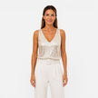 Women's sequin V-neck top by FJØRNA, stylish evening wear shirt with shimmering sequins and a flattering V-neck design.