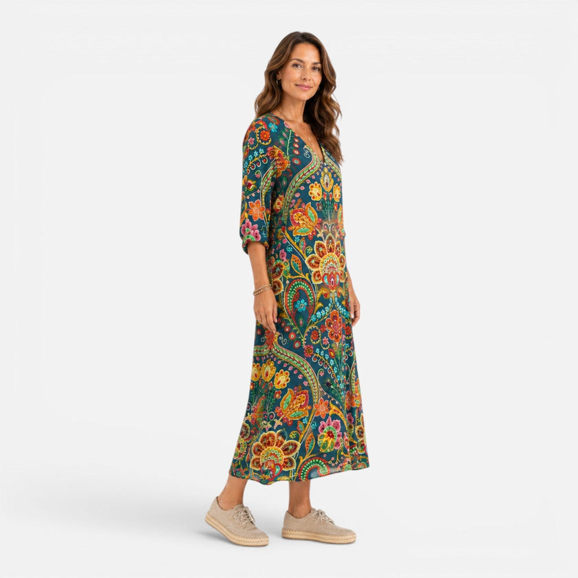 FJØRNA women's bohemian floral maxi dress with flowing fabric and vibrant floral pattern, perfect for casual and summer wear.