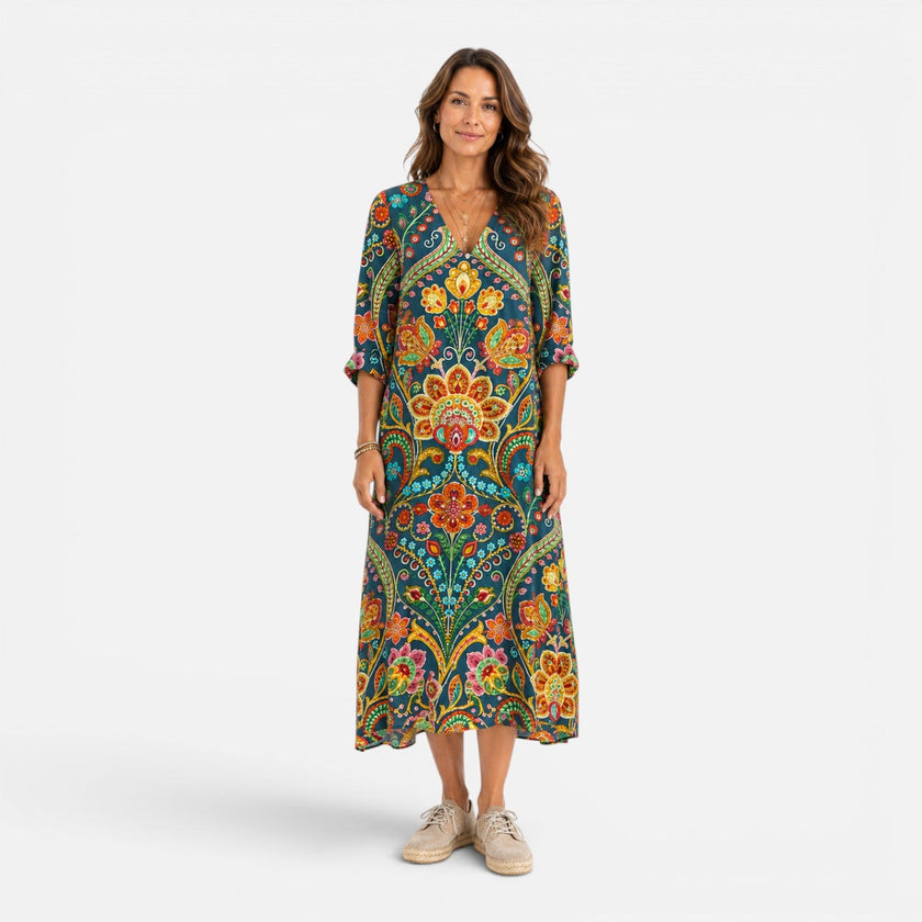 FJØRNA women's bohemian floral maxi dress with flowing fabric and vibrant flower patterns, perfect for summer or casual wear.