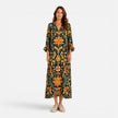 FJØRNA women's bohemian floral maxi dress with flowing fabric and vibrant print, perfect for summer or casual wear.