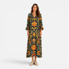 FJØRNA women's bohemian floral maxi dress with flowing fabric and vibrant print, perfect for summer or casual wear.