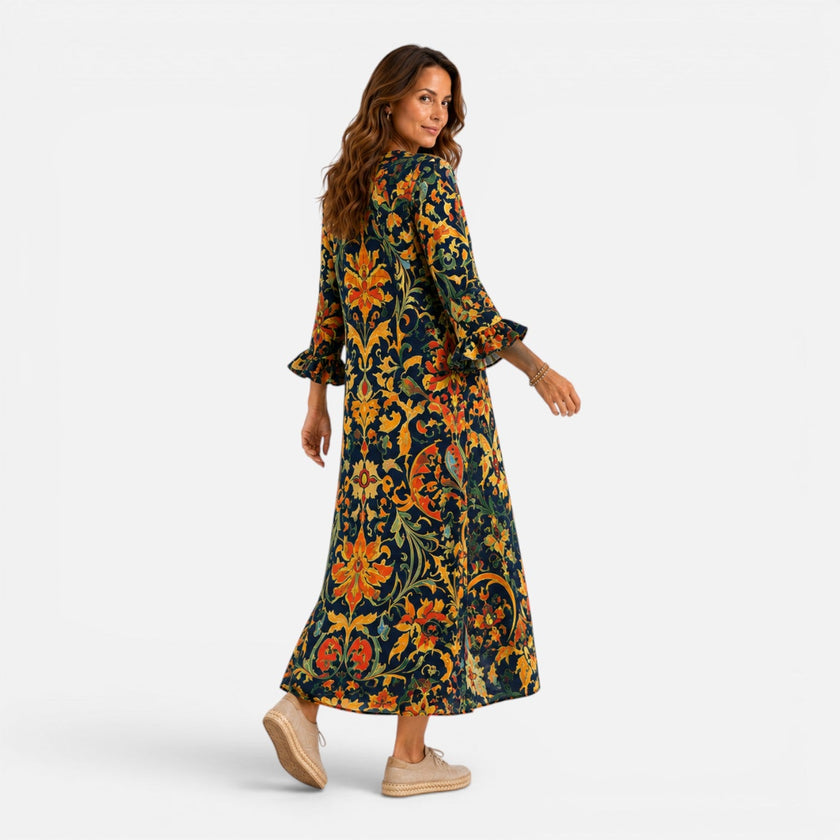 FJØRNA women's bohemian floral maxi dress with flowing fabric and vibrant pattern, ideal for casual or summer wear.