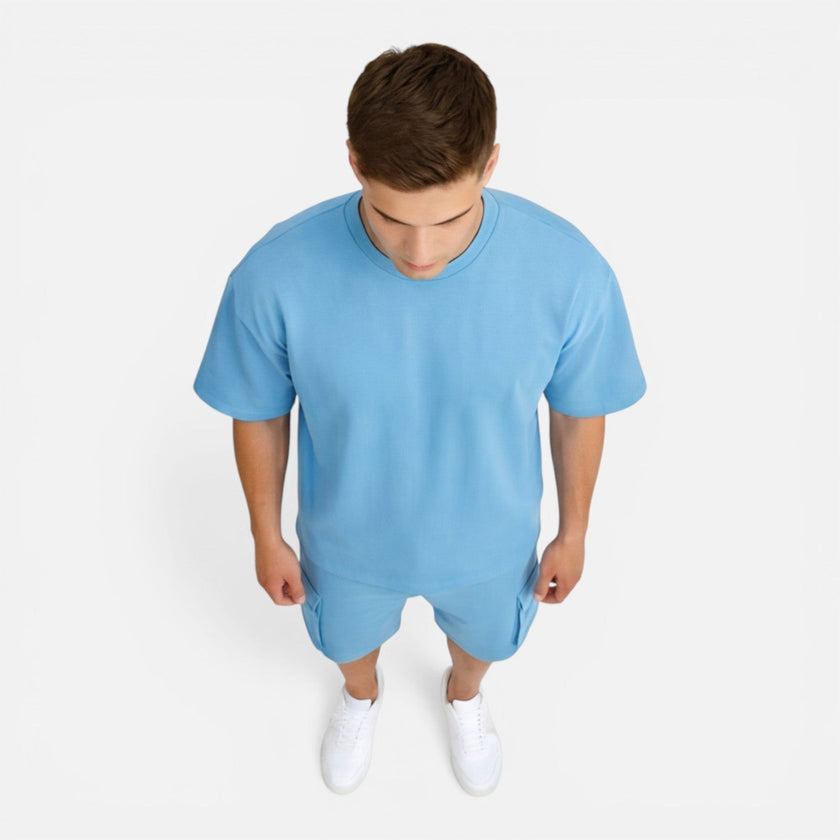 Men's casual summer matching T-shirt and cargo shorts set by FJØRNA, featuring a relaxed fit and comfortable fabric.