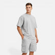 Men's casual summer matching T-shirt and cargo shorts set by FJØRNA, featuring a comfortable, relaxed fit for warm weather.