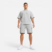 Men's casual summer matching T-shirt and cargo shorts set by FJØRNA, featuring a relaxed fit in lightweight fabric.
