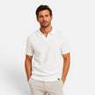 Men's slim fit knit polo shirt by FJØRNA, lightweight and breathable, showcasing the collar, knit texture, and fit.