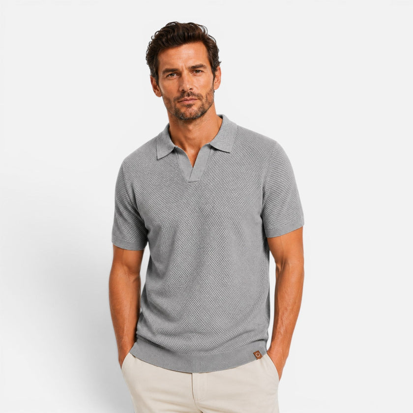 Men's slim fit knit polo shirt by FJØRNA, lightweight and breathable, shown in a close-up of the shirt's fabric and collar details.