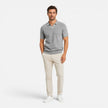 Men's slim fit knit polo shirt by FJØRNA, lightweight and breathable, shown in a close-up of the shirt's fabric and collar.