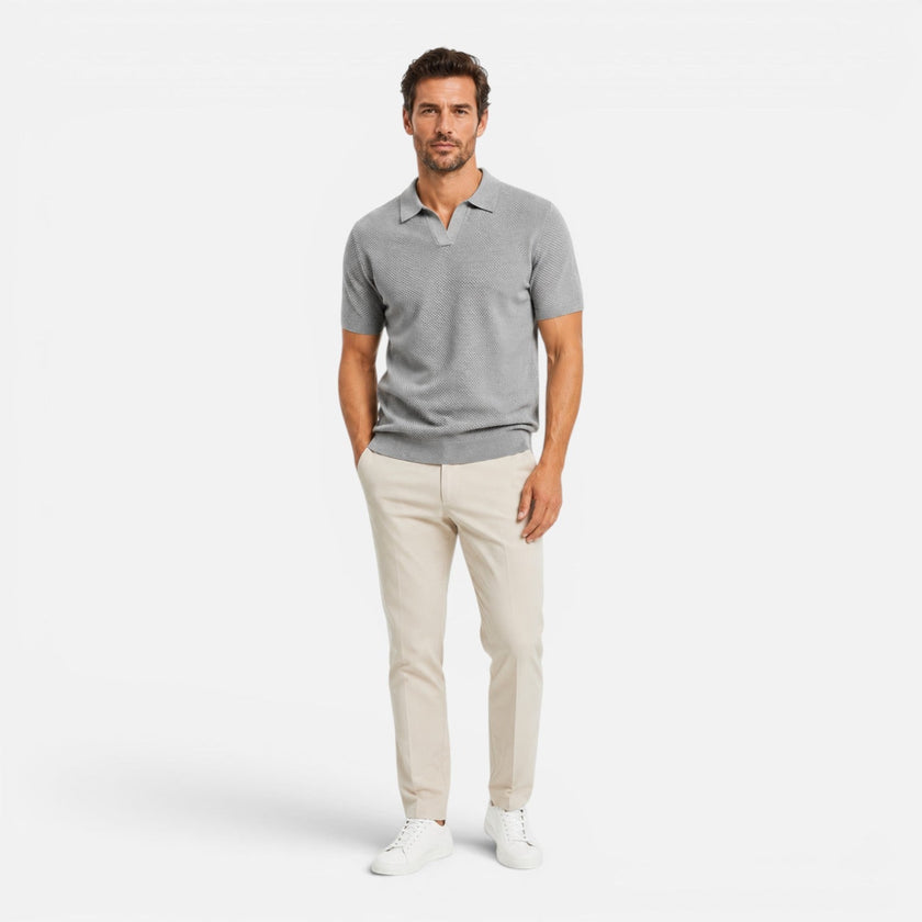 Men's slim fit knit polo shirt by FJØRNA, lightweight and breathable, shown in a close-up of the shirt's fabric and collar.
