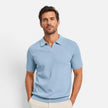 Men's slim fit knit polo shirt by FJØRNA, lightweight and breathable, shown in a close-up of the shirt's fabric and collar detail.