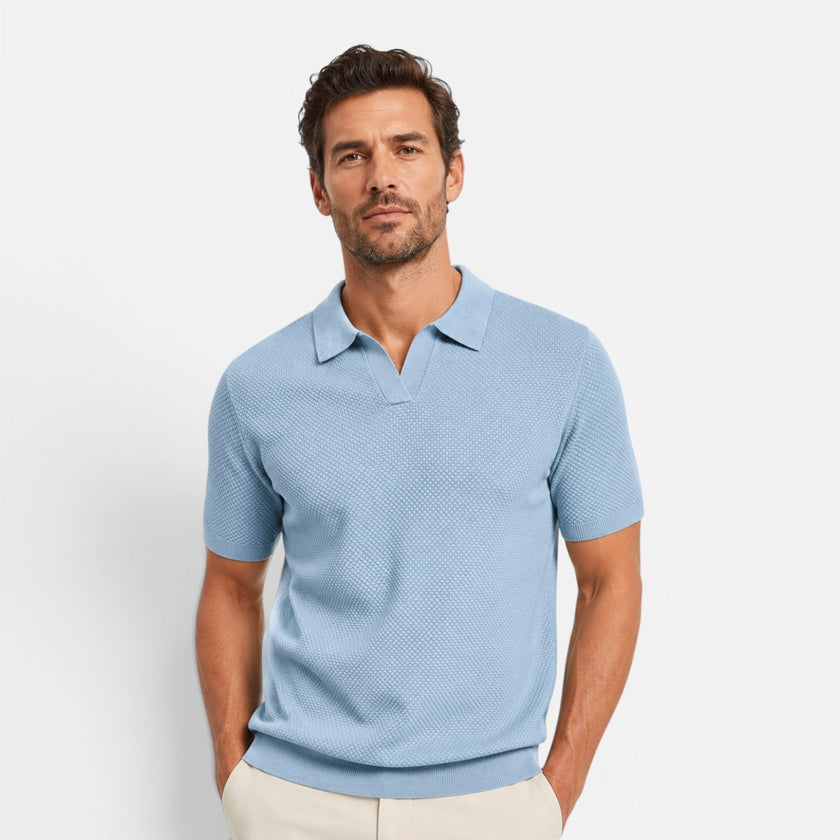 Men's slim fit knit polo shirt by FJØRNA, lightweight and breathable, shown in a close-up of the shirt's fabric and collar detail.