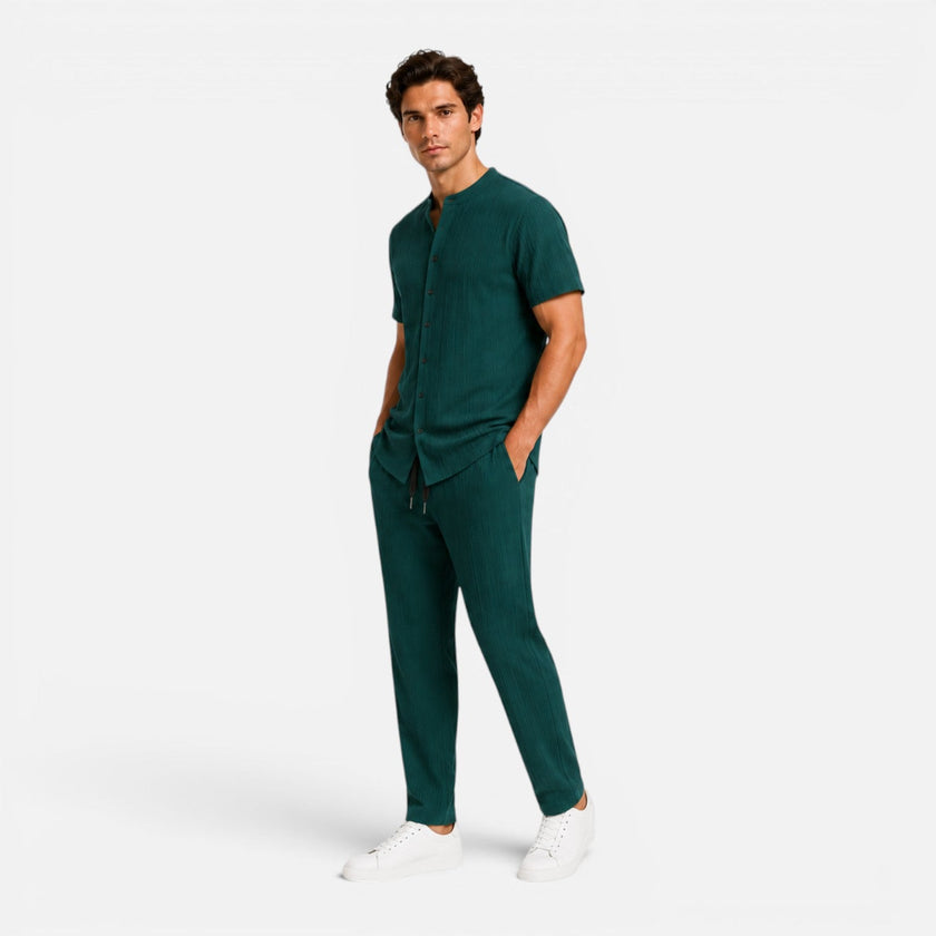Men's summer matching set by FJØRNA featuring lightweight shirt and trousers, styled for casual warm-weather wear.