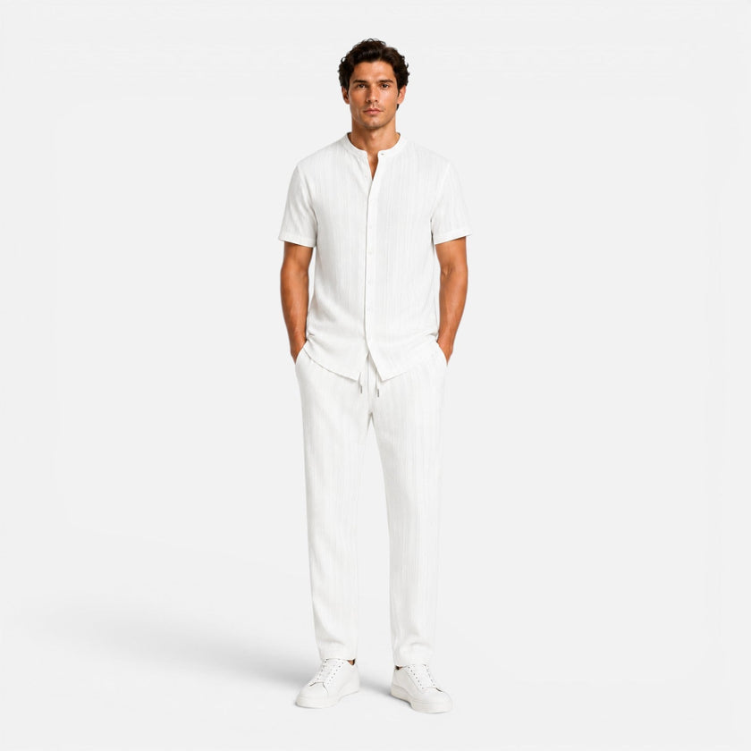 Men's summer matching set by FJØRNA featuring lightweight shirt and trousers, casual and breathable for warm weather.