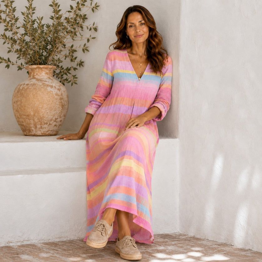 FJØRNA women's striped maxi dress with flowing fabric and bold vertical stripes, perfect for casual or summer wear.