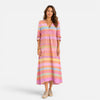 FJØRNA women's striped maxi dress featuring a flowing silhouette and bold horizontal stripe pattern on lightweight fabric.