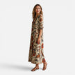 Women’s bohemian floral maxi dress by FJØRNA featuring a flowing silhouette and vibrant floral pattern.