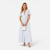 FJØRNA women's elegant maxi dress with deep V-neck and puff sleeves, perfect for formal occasions, shown in a full-length view.